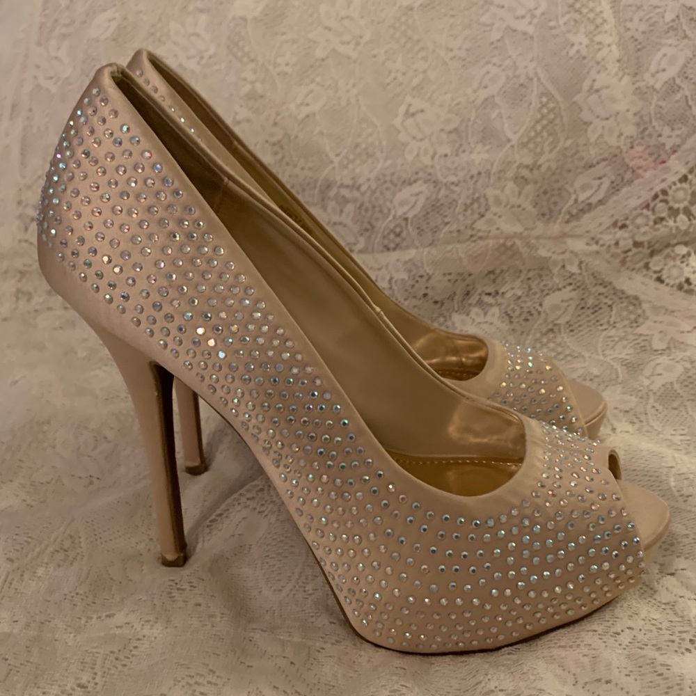 J. Lo Champagne Blush jeweled platform stilettos.